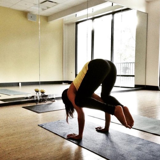 Frog pose in yoga class